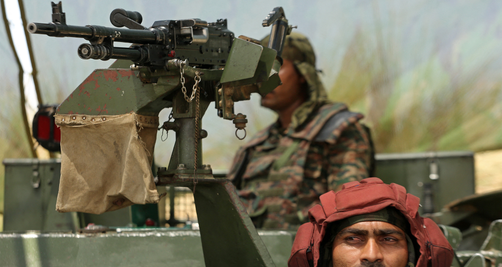 Indian army soldiers in an armoured vehicle at Akhnoor sector near the Line of Control (LoC) between India and Pakistan, in Jammu region on May 19, 2025. | Photo: Mukesh Gupta/AFP via Getty Images